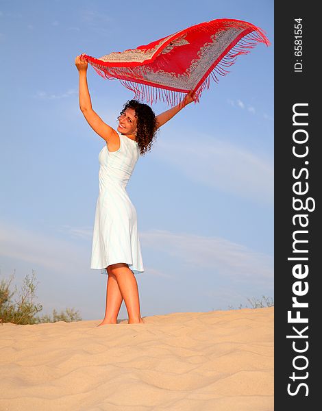 Girl On Sand With Shawl In Hands