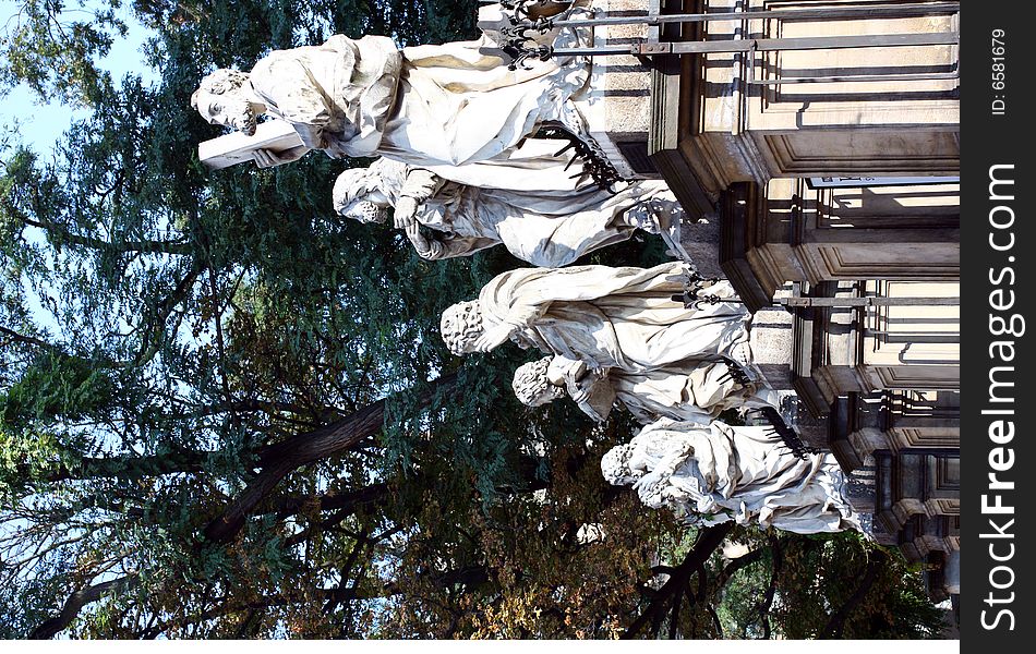 Sculptures of six apostles at the gates of catholic church