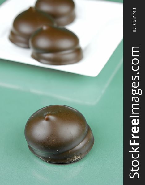 Marshmallow biscuits isolated against a green background