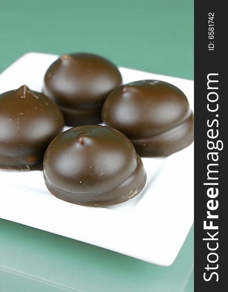 Marshmallow biscuits isolated against a green background