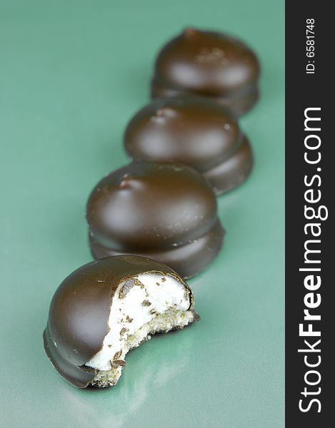 Marshmallow biscuits isolated against a green background