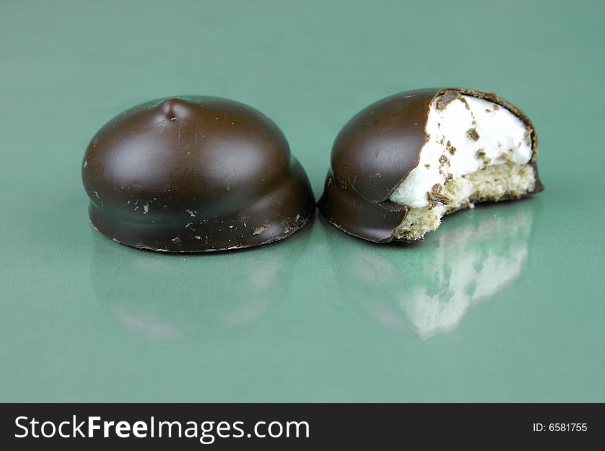 Marshmallow biscuits isolated against a green background