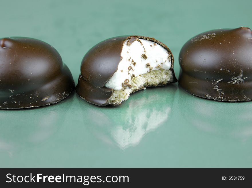 Marshmallow biscuits isolated against a green background