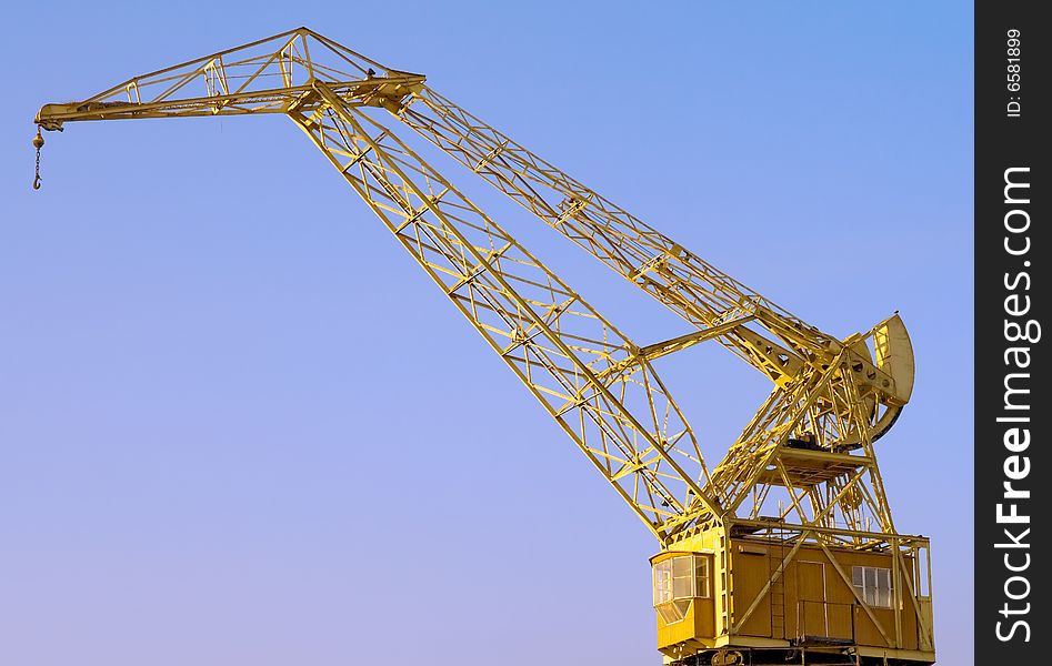 Old Crane with a blue sky in the background.