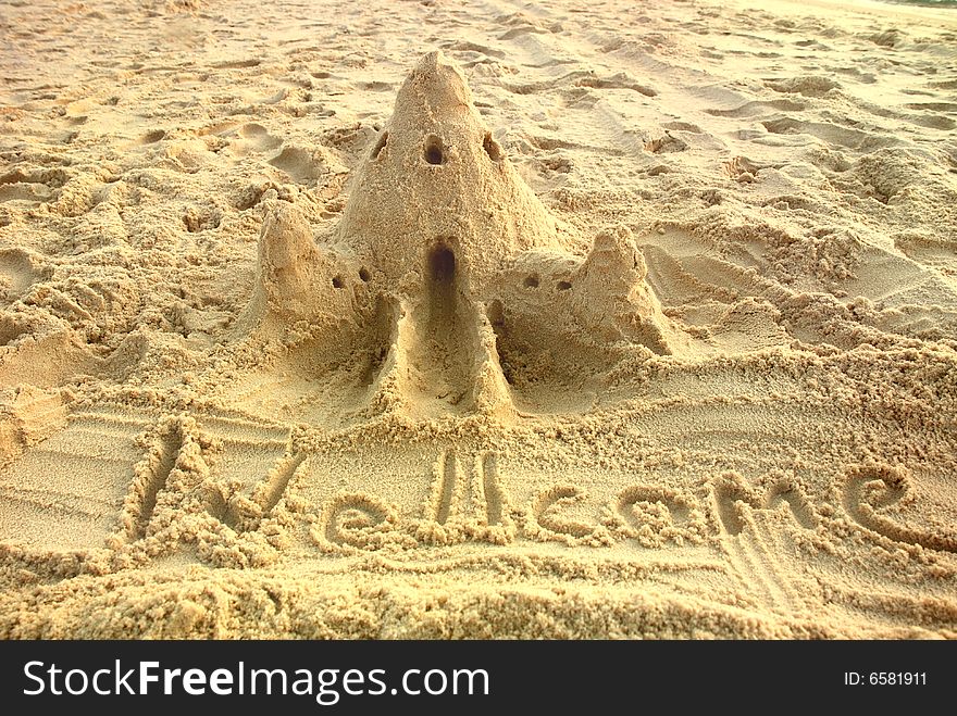 a castle on the sand of the beach