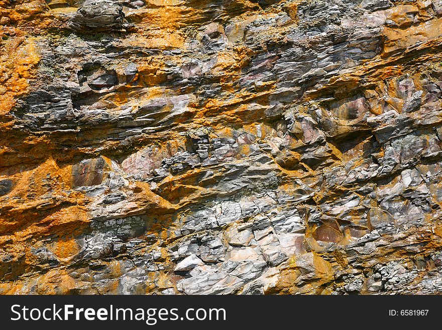 Close-up of a yellow - grey rock background