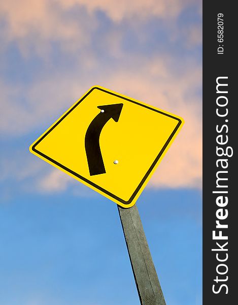 Road sign against sky at dusk with clipping path.