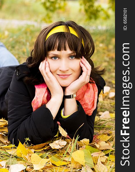 Beautiful girl in the park on the grass