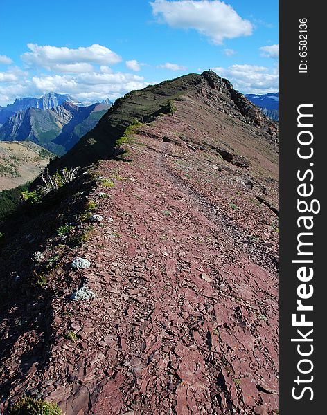 A red color mountain peak on Carthew-Alderson Trail in Waterton National Park Alberta Canada. A red color mountain peak on Carthew-Alderson Trail in Waterton National Park Alberta Canada