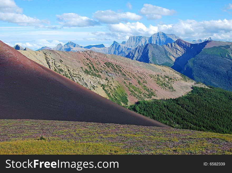 A red color mountain peak on Carthew-Alderson Trail in Waterton National Park Alberta Canada. A red color mountain peak on Carthew-Alderson Trail in Waterton National Park Alberta Canada