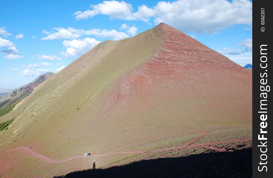 A red color mountain peak on Carthew-Alderson Trail in Waterton National Park Alberta Canada. A red color mountain peak on Carthew-Alderson Trail in Waterton National Park Alberta Canada