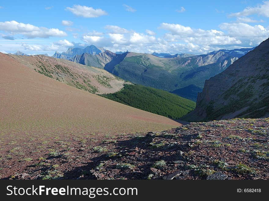 A red color mountain peak on Carthew-Alderson Trail in Waterton National Park Alberta Canada. A red color mountain peak on Carthew-Alderson Trail in Waterton National Park Alberta Canada