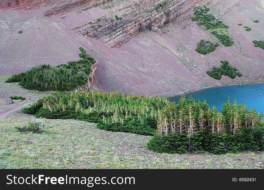 A red color mountain peak on Carthew-Alderson Trail in Waterton National Park Alberta Canada. A red color mountain peak on Carthew-Alderson Trail in Waterton National Park Alberta Canada