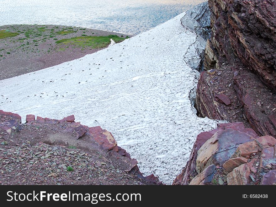 Snow Residue Surrounded By Colorful Rocks