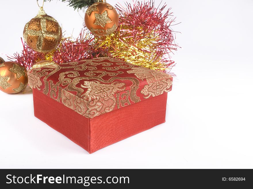 Present box under the Christmas tree isolated on a bright background. Present box under the Christmas tree isolated on a bright background