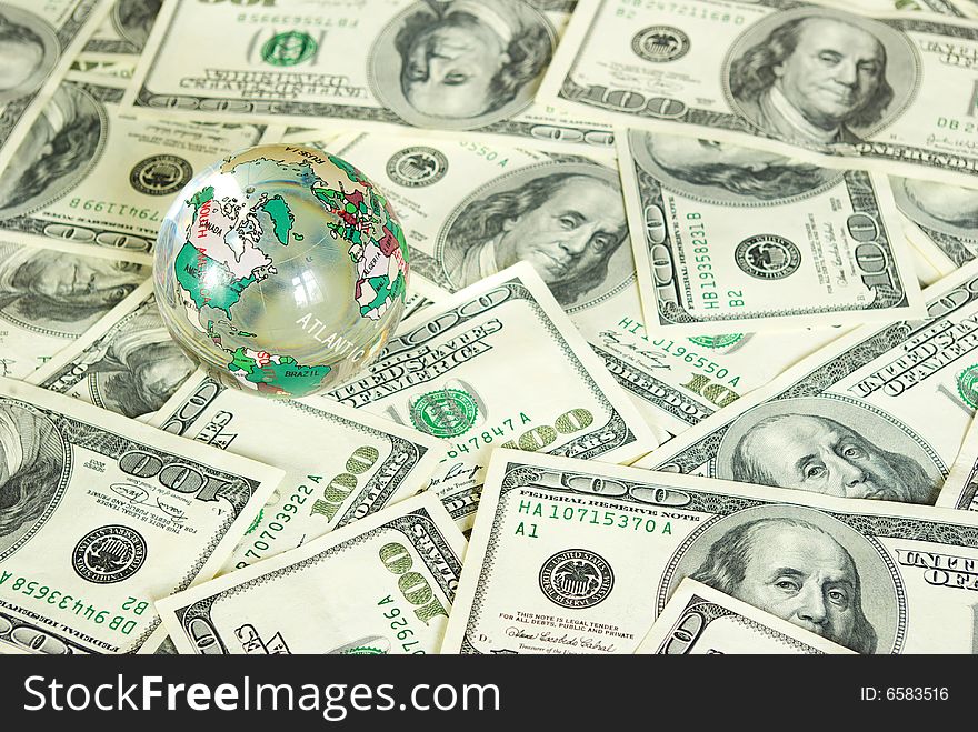 Globe isolated on a dollars background. Globe isolated on a dollars background