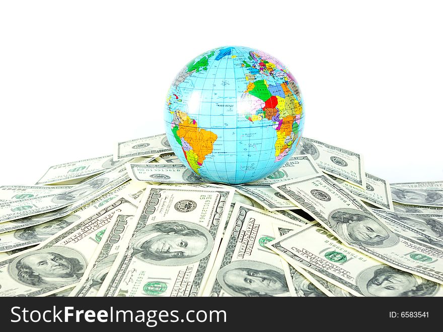 A globe and dollars is isolated on a whiteness