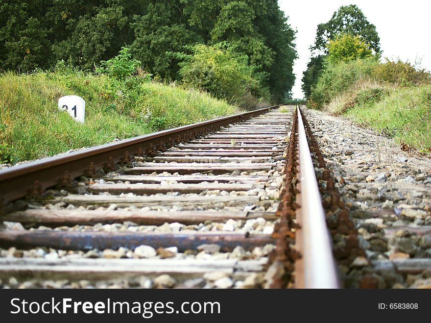 Empty old railroad near forest. Empty old railroad near forest