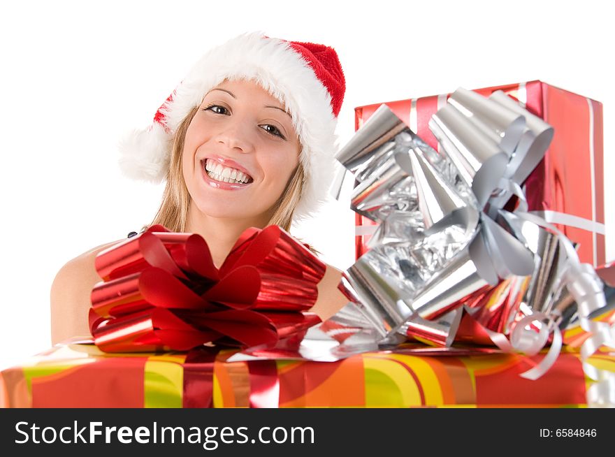 Girl with Santa's hat and colorful Christmas gifts