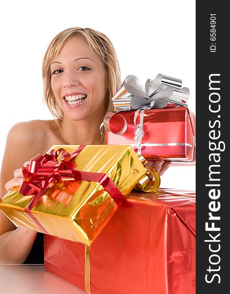 Blond smiling girl offers xmas gifts. Blond smiling girl offers xmas gifts