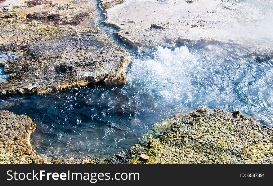 Volcanic Thermal bubbling pool in the Hidden VAlley, North Island, New Zealand.Boiling hot water. Volcanic Thermal bubbling pool in the Hidden VAlley, North Island, New Zealand.Boiling hot water.