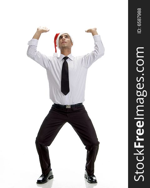 Young businessman looking upward against white background