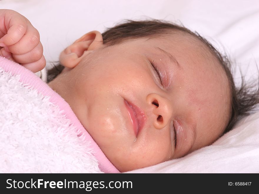 Cute baby girl sleeping in her bed. Cute baby girl sleeping in her bed