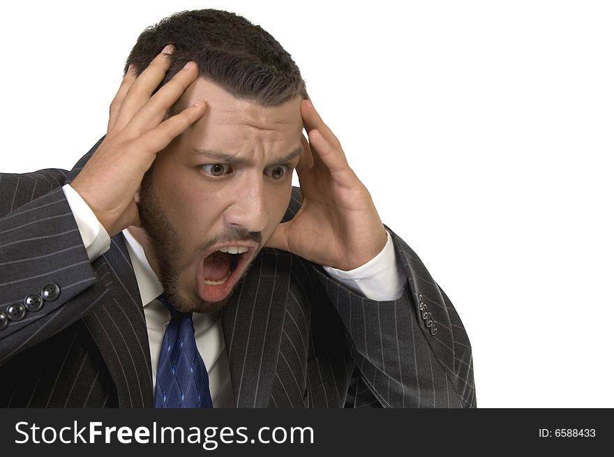 Businessman shouting in tension against white background