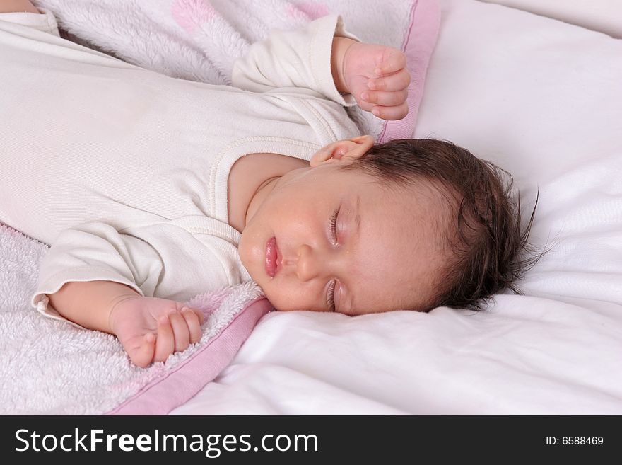 Cute baby girl sleeping in her bed. Cute baby girl sleeping in her bed