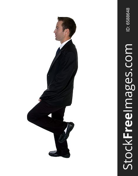 Young businessman bunting one leg against white background. Young businessman bunting one leg against white background