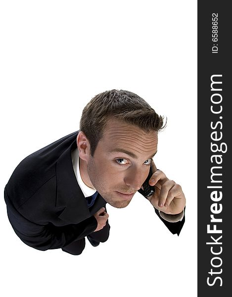 Businessman busy on phone call and looking upwards on an isolated white background