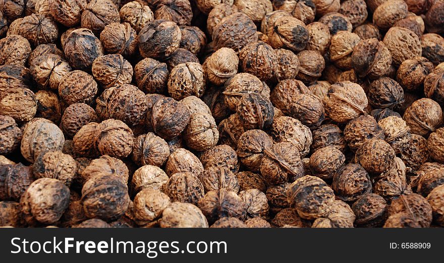 The dark brown and round walnut background. The dark brown and round walnut background.