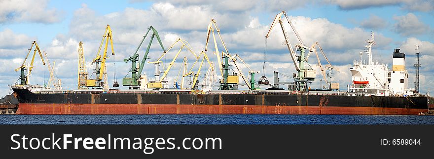 Loading by coal of the cargo ship in the Riga port. Loading by coal of the cargo ship in the Riga port.