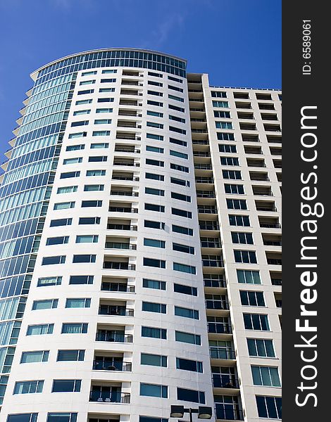 Condo Tower Balconies Into Blue Sky