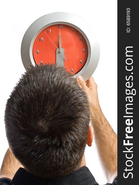 Young man, holding a clock in front of him. Young man, holding a clock in front of him