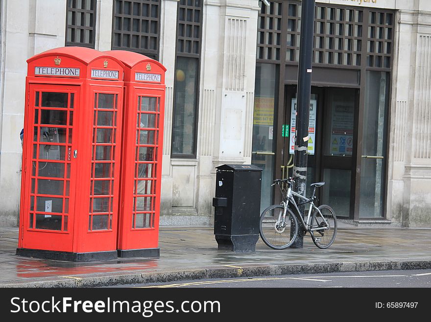Telephone boxes, red, symbol of London. Photo made in the capital of the United Kingdom. Telephone boxes, red, symbol of London. Photo made in the capital of the United Kingdom.