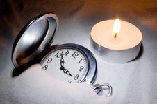 Watch Covered With Sand And A Candle Royalty Free Stock Photo