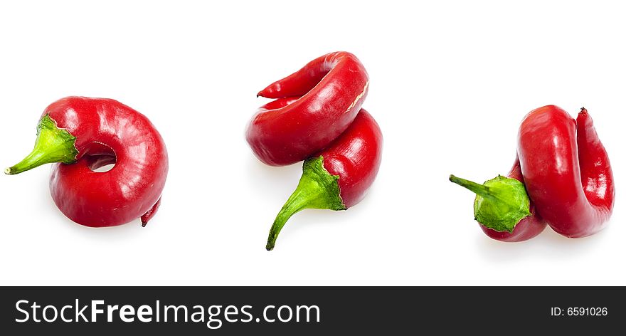 Red hot peppers over white