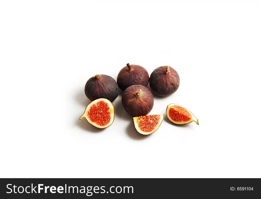 Figs isolated on white background. Purpled fresh fruits with seeds.