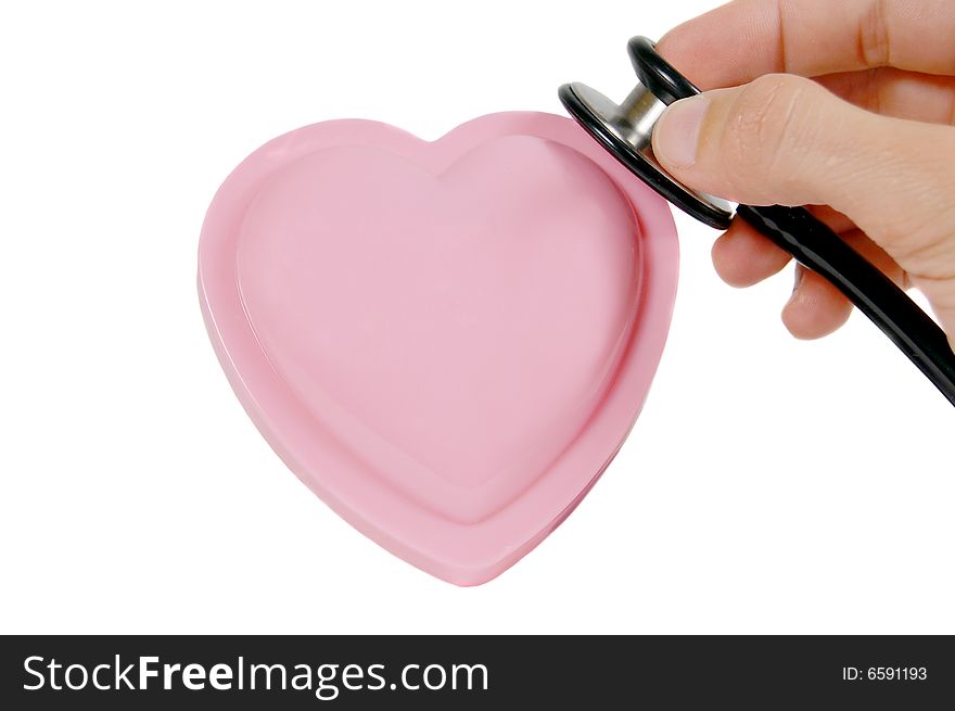 Hand with stethoscope checking a pink heart isolated on white. Hand with stethoscope checking a pink heart isolated on white
