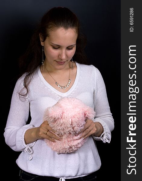 Female looking into plush toy in hands. Female looking into plush toy in hands