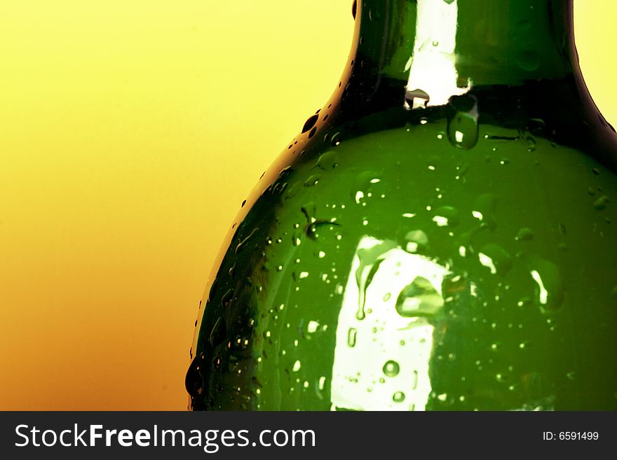 Green bottle on yellow background