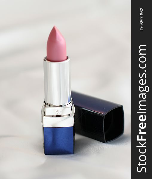 Close-up of a lipstick over white background. Close-up of a lipstick over white background