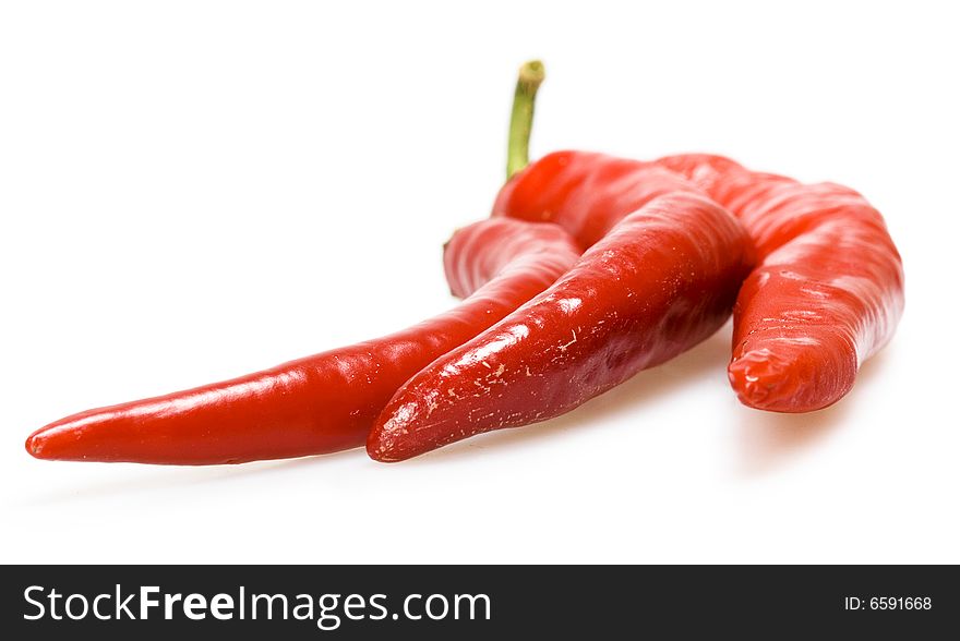 3 red hot peppers on white. 3 red hot peppers on white