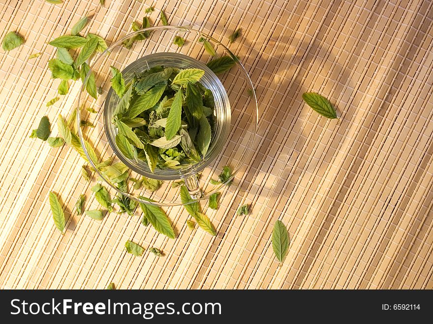 Green tea freshness. Cup full of leaves. Natural Drink.