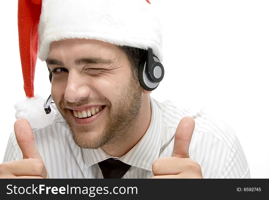 Happy businessman posing with cheer up and wearing santa cap