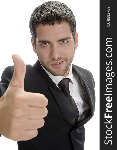 Attractive businessman showing thumbs up