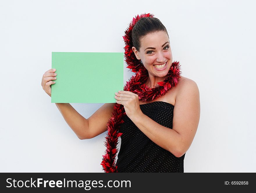 Beautiful woman holding a green card for Christmas. Beautiful woman holding a green card for Christmas.