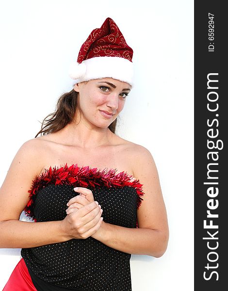 Beautiful young woman dressed in a festive Christmas outfit. Beautiful young woman dressed in a festive Christmas outfit.