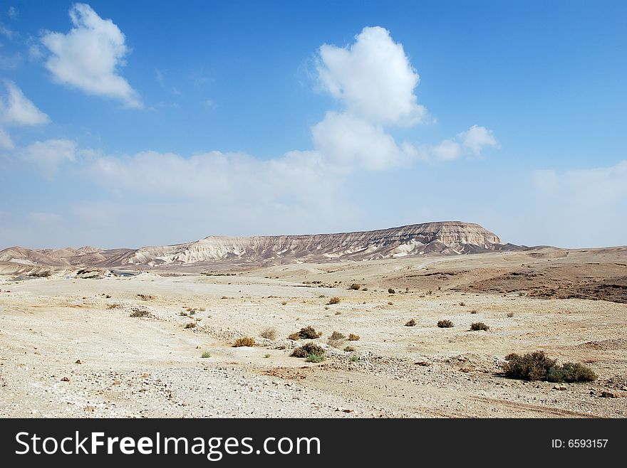 Fragment of Judaic desert with mountains on a distance shot. Fragment of Judaic desert with mountains on a distance shot
